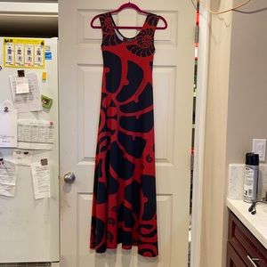 Kini Zamora, red dress black Nautilus print.